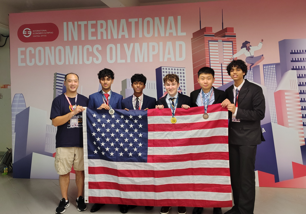 Team USA pictured with the US flag at an IEO event